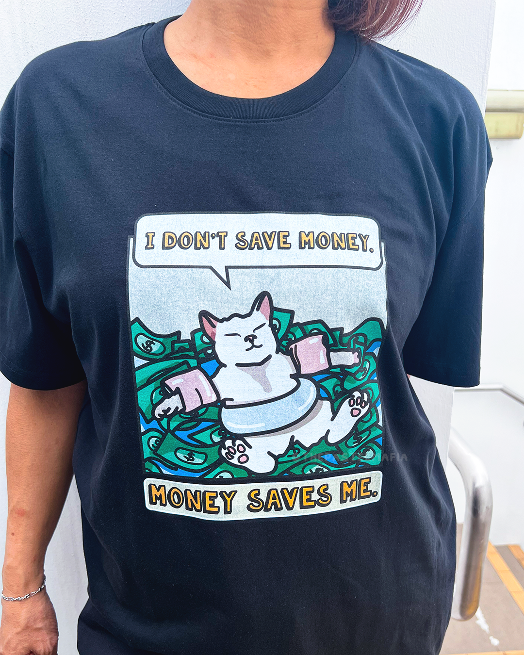 (limited) "i don't save money. money saves me." cat meme graphic t-shirt