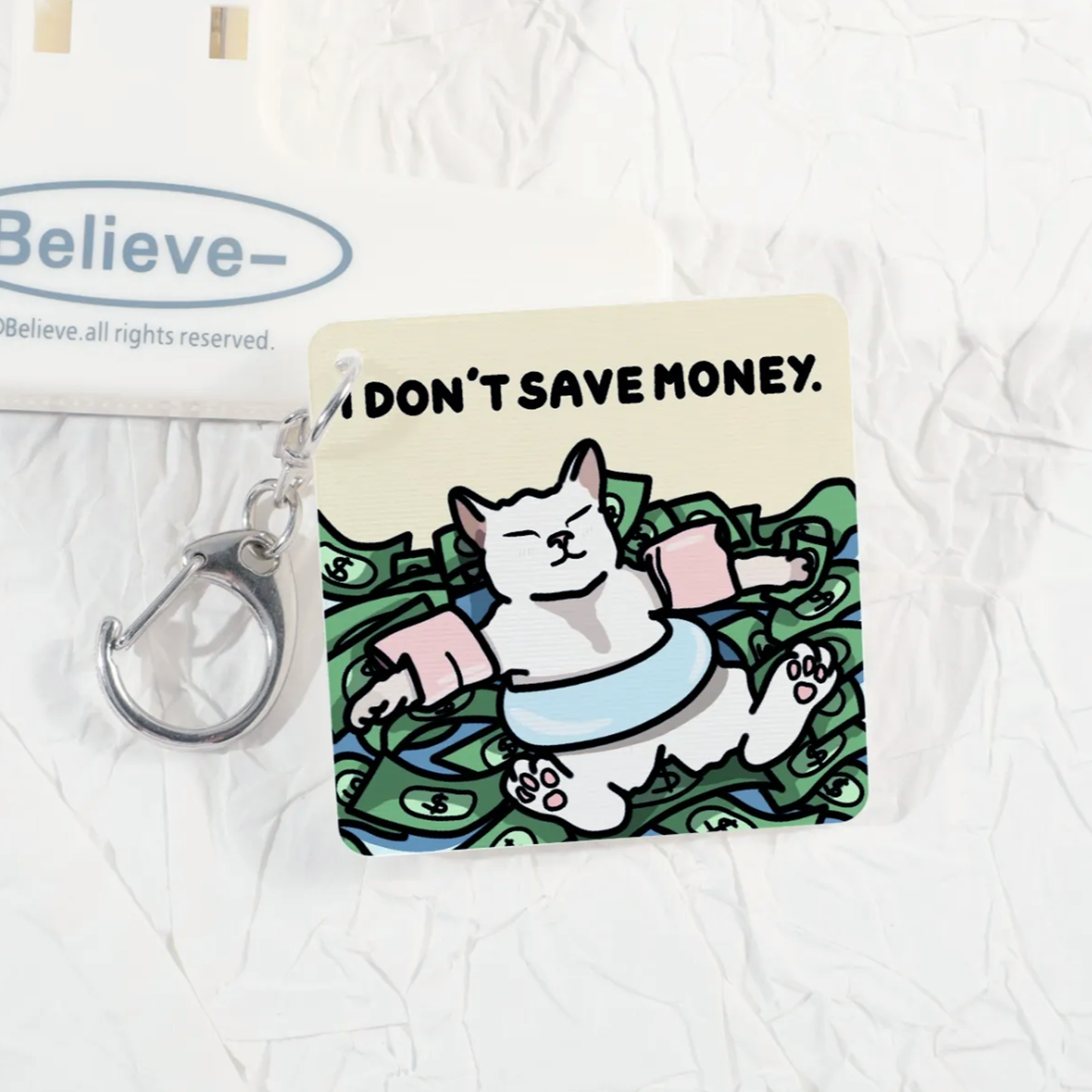(limited) "i don't save money, money saves me" lenticular keychain